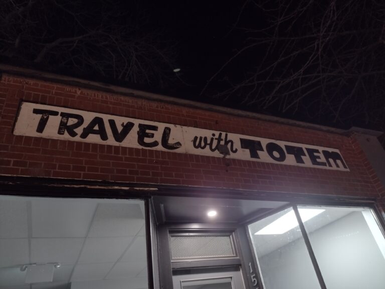 Ghost sign for Totem Travel reappears in Trail