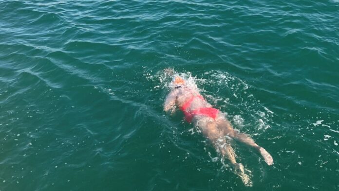 Photo of Aerin swimming the English Channel.